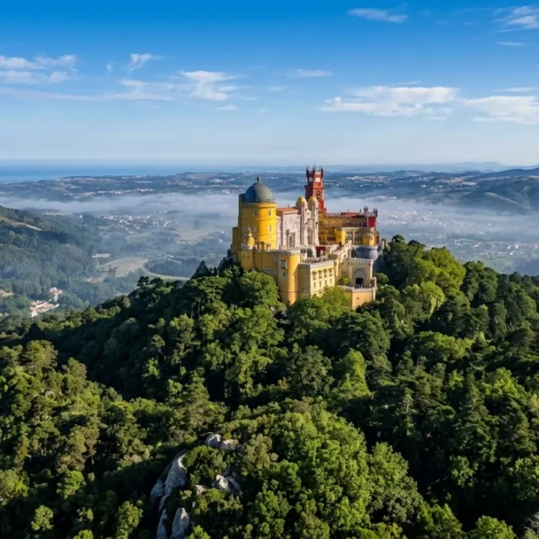 Pena Palace on its hilltop in Sintra, the starting point for a Pena Palace and Quinta da Regaleira one-day visit