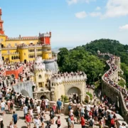 Crowds filling the terraces of Pena Palace in Sintra on a busy summer day